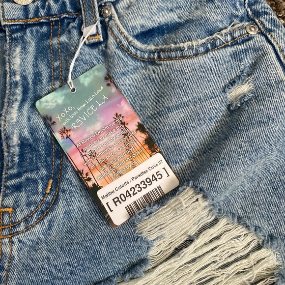 NWT Revice shorts with cut out. Run small so I would say fit more like a 25-26 - Picture 4 of 4